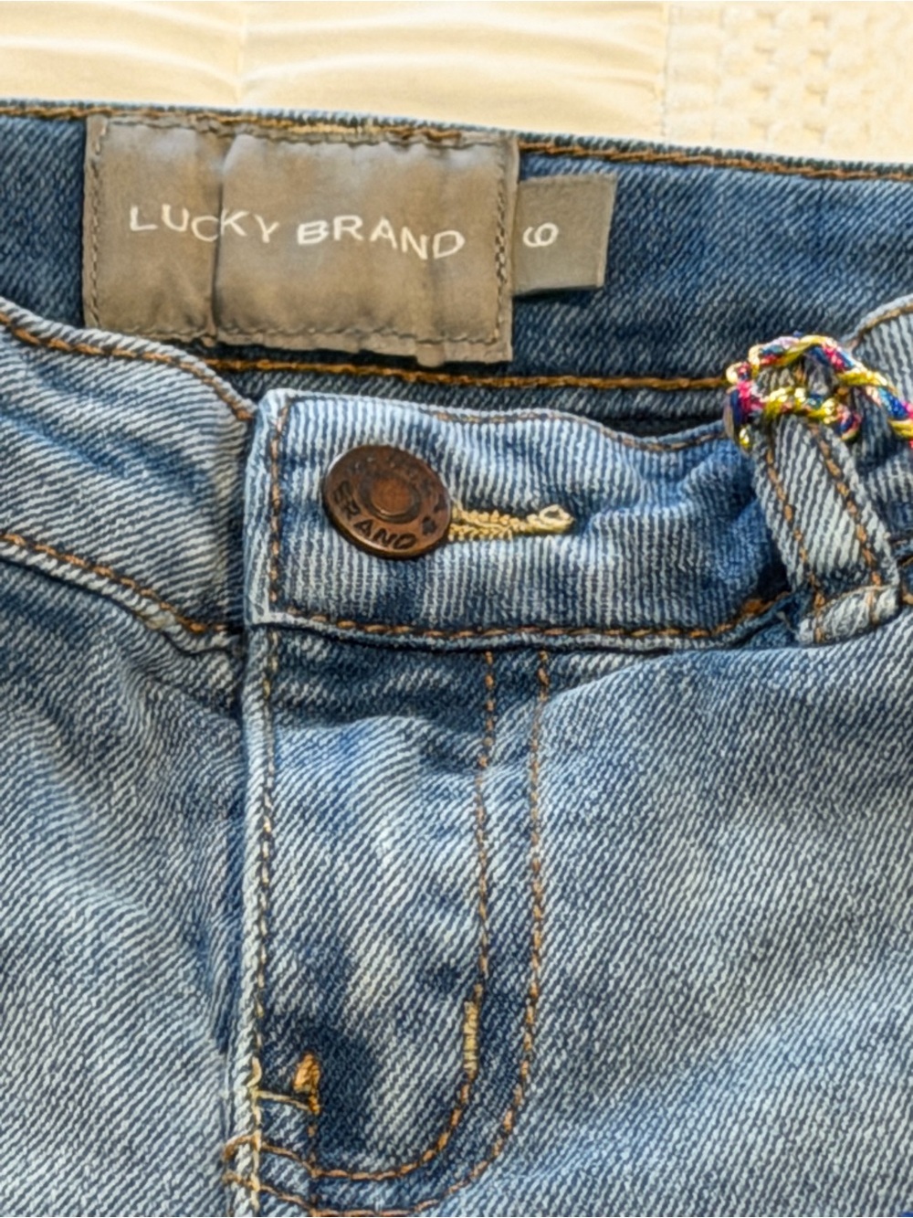 Lucky Brand Medium Light Blue Denim Jeans with Multicolor Belt Loop Detail